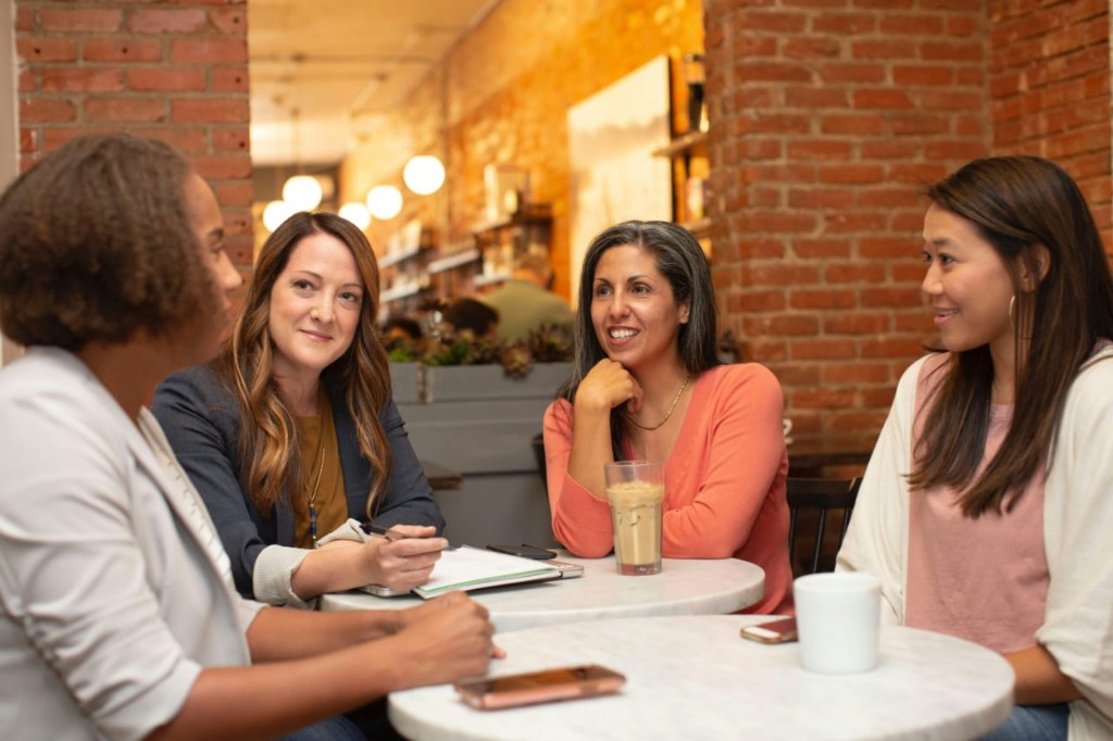 Women supporting one another in a community exchange